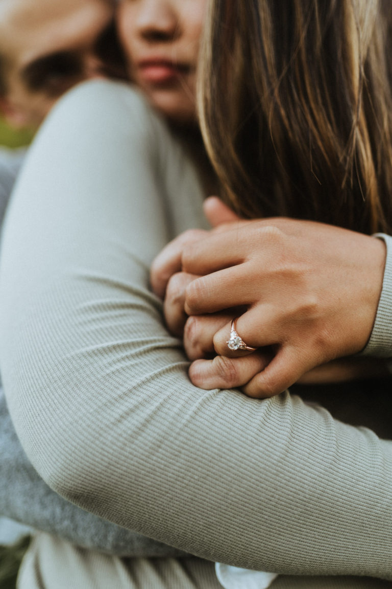 Hug from behind pose with close up to a ring
