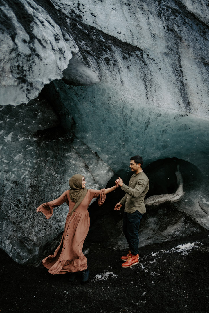 Couple dancing in Ice Cave in Iceland