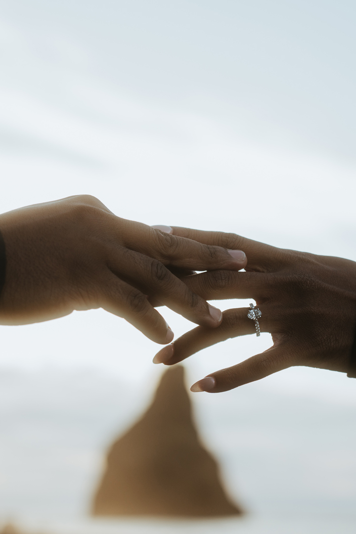 Hands with engagement ring on